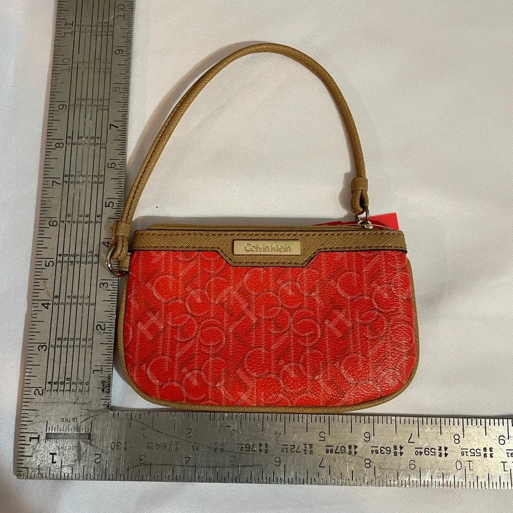 Calvin Klein Wristlet Women’s zipper coin purse 5x7‎ Orange W/Tan Trim w/CK logo